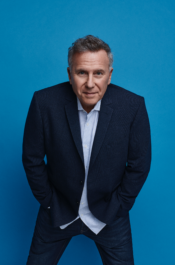 Man in a dark blue suit on a blue background