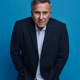 Man in a dark blue suit on a blue background